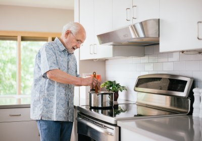 man cooking on an induction stove
