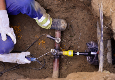 man welding a gas pipe