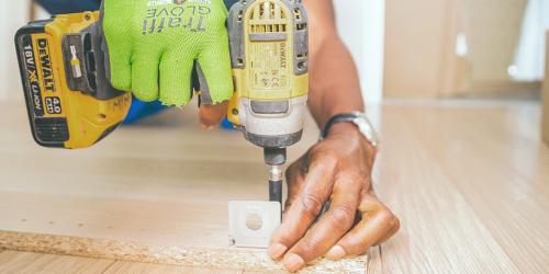 man drilling wood 