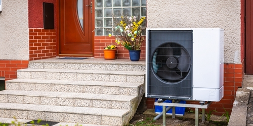 An air source heat pump on the site of a home