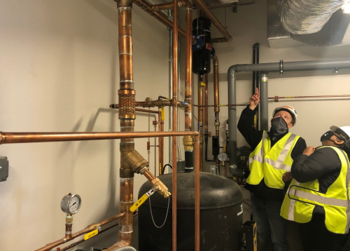 Cody and Rinika monitoring energy use at job site