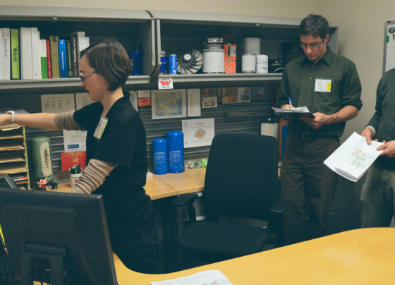 women measuring a desk space
