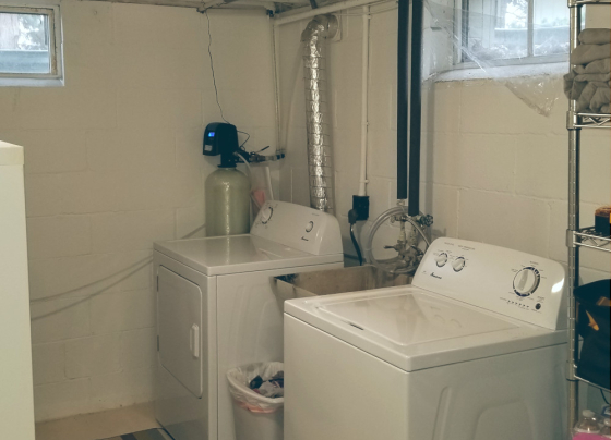 water and dryer in a basement