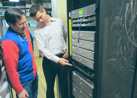 Two men inspecting a data center
