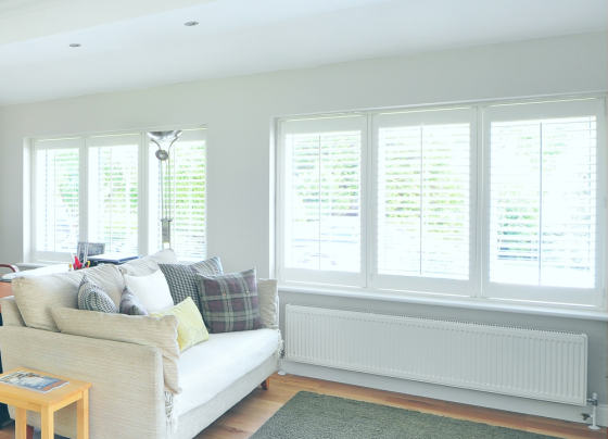 White living room with lots of windows