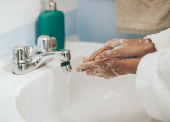 person washing their hands